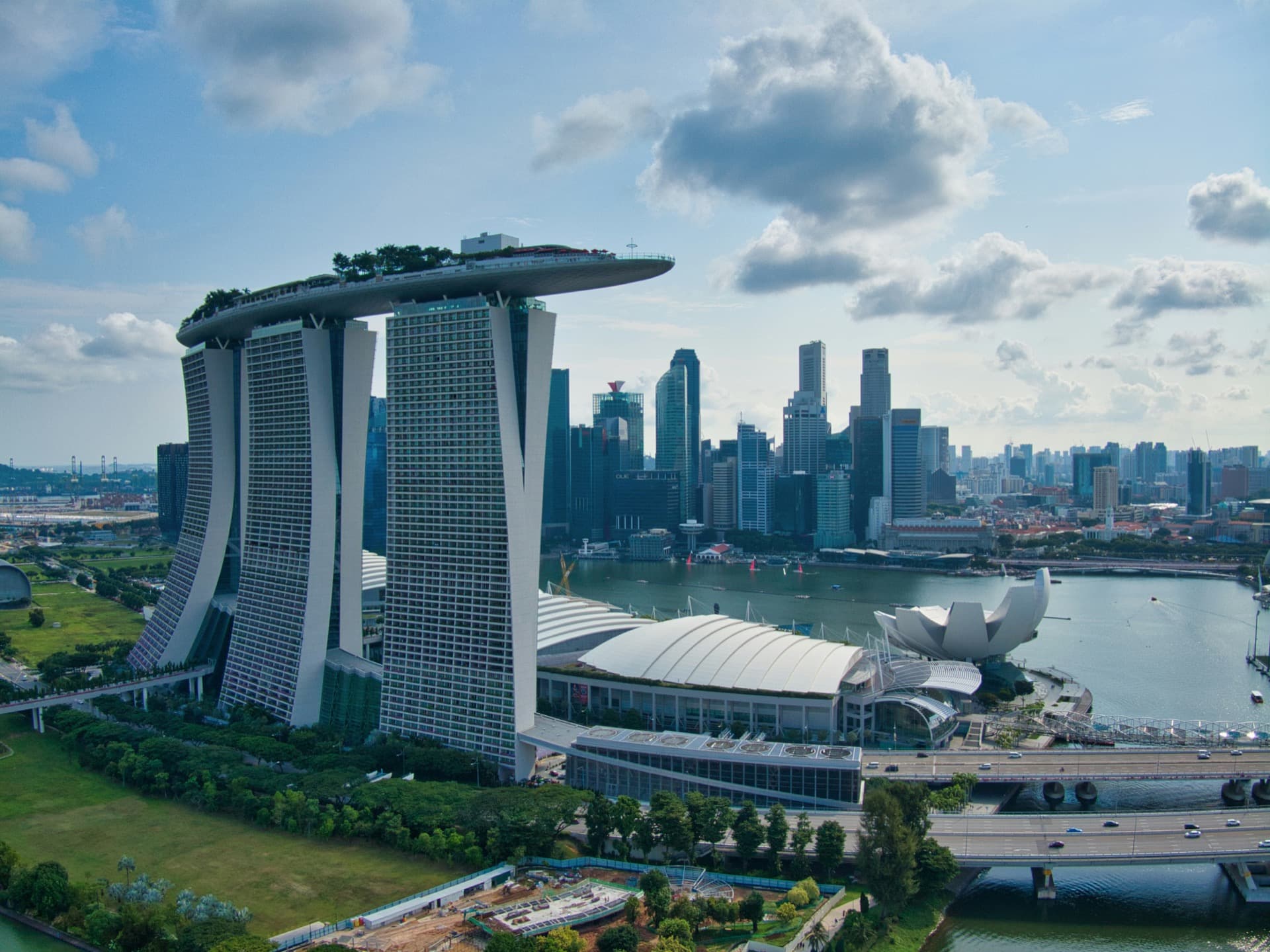 Singapore skyline and global maritime trade hub representing precision contract manufacturing infrastructure