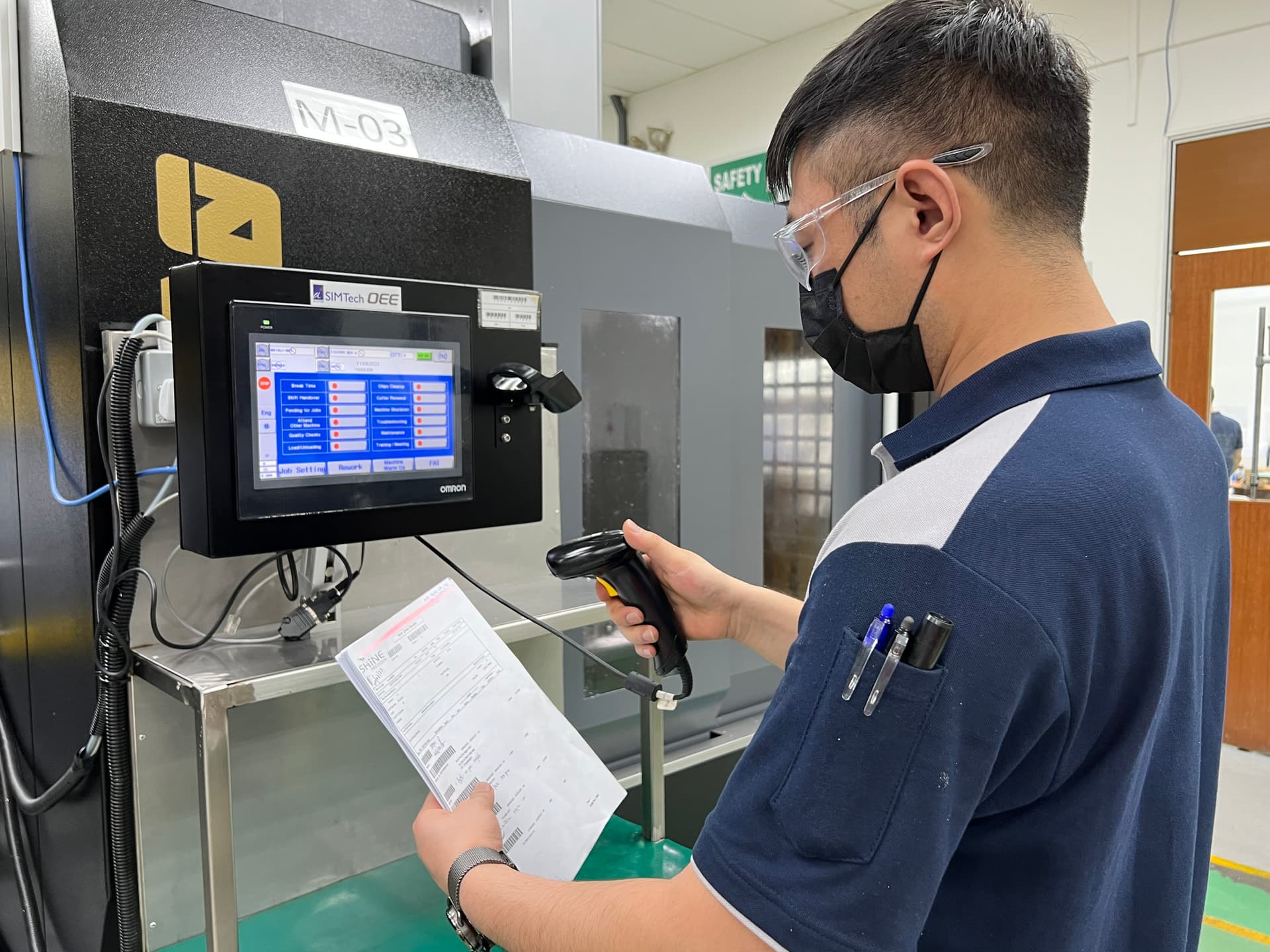 A staff scanning a barcode on a document