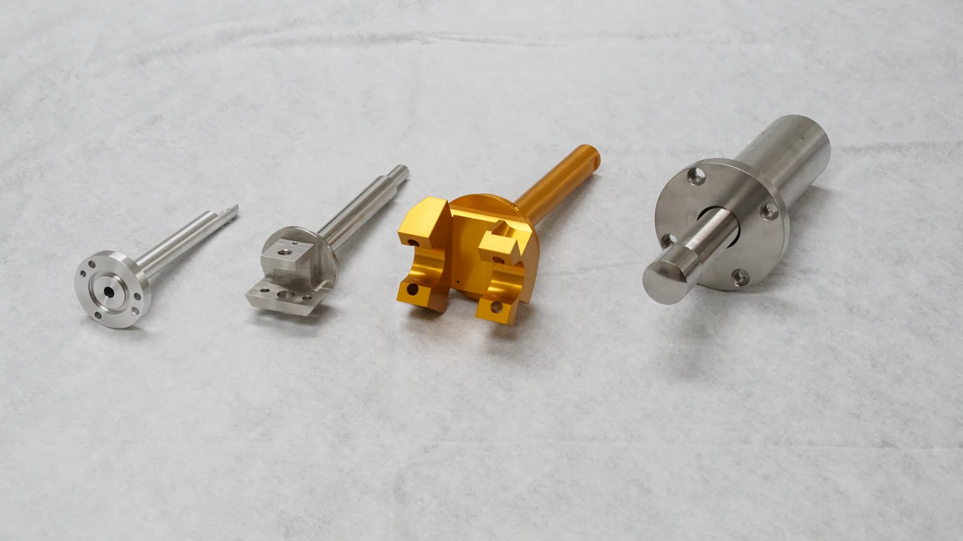 Multi-process CNC milled and turned aluminum manifold with Type II gold anodizing