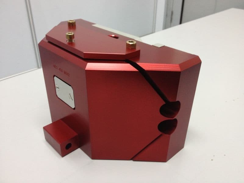 CNC milled 6061 aluminum component with Type II red anodized finish